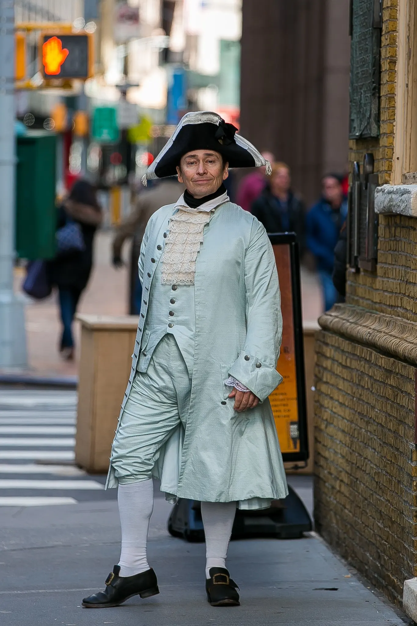 Crossing a New York street in a mint colonial coat