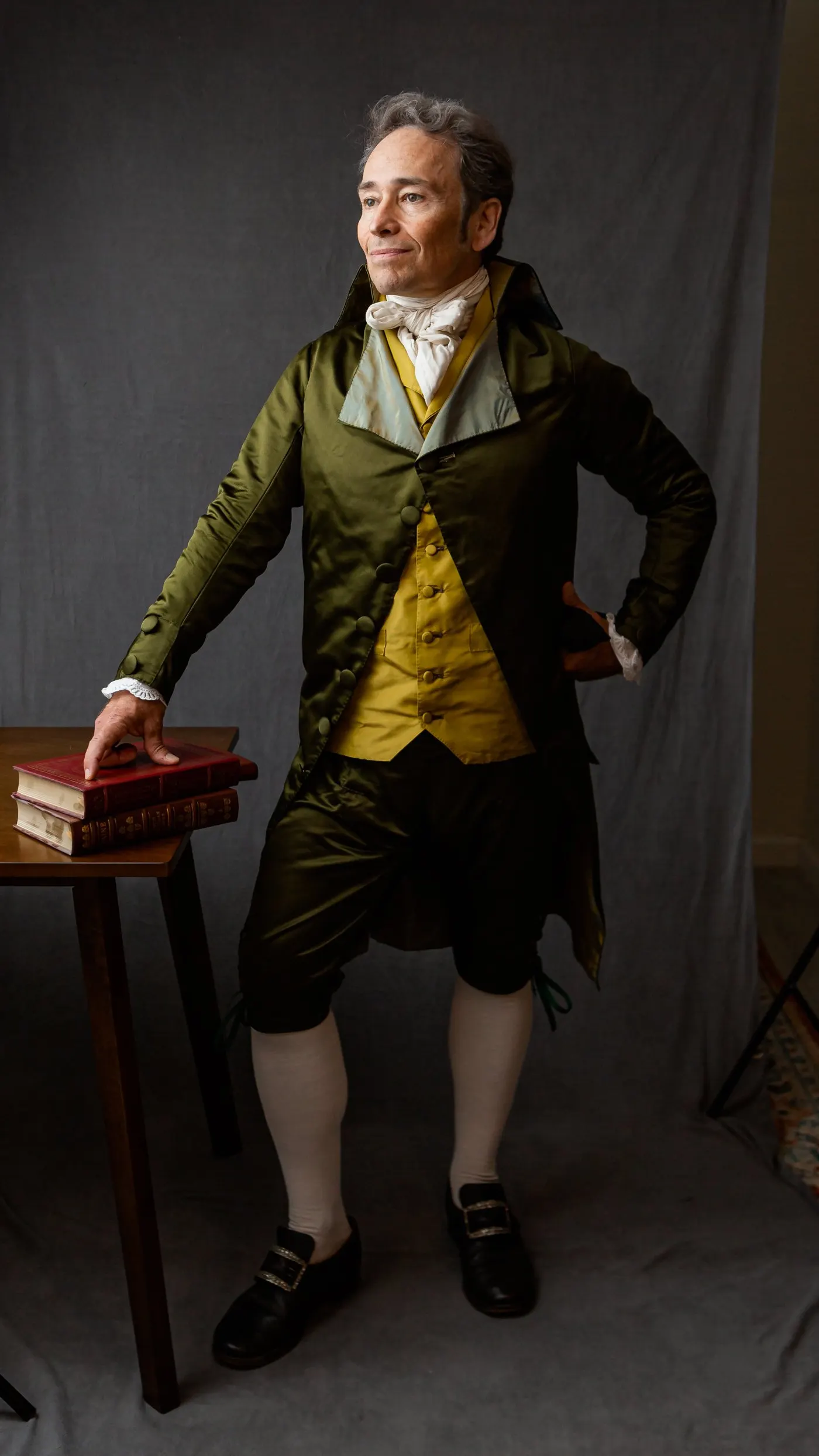 Full-length studio portrait in satin attire